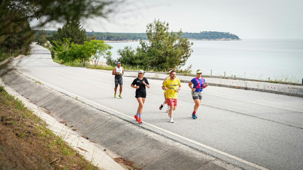 Group of runners enjoying a scenic coastal route in Gelibolu, Türkiye.